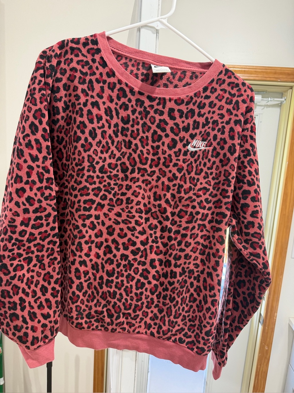 Nike Women's Pink Leopard Print Crewneck Sweater